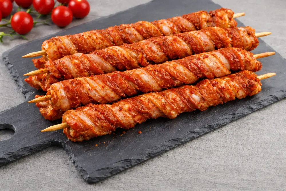 Spiedini di pancetta marinati